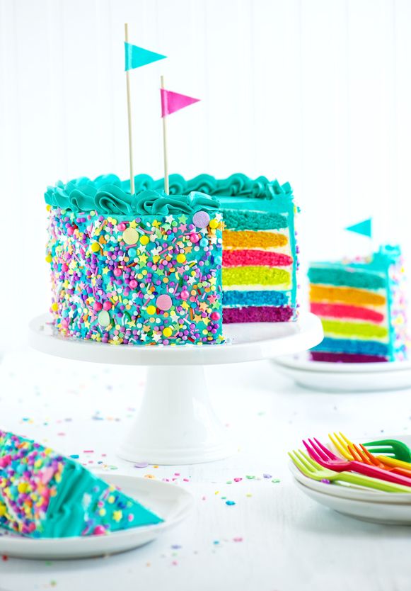 there is a colorful cake with sprinkles on it