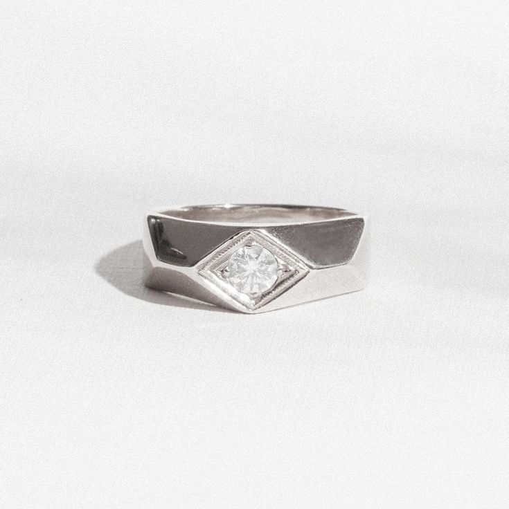 Item Details: Ring's top width is 7.5mm tapering to 3mm at the base One round brilliant diamond 0.35 ctw. (F/SI1) ideal cut Comfort fit interior Cast in your choice of 14K gold or platinum Please allow two to three weeks for deliveryFor questions or design modifications, please contact  custom@berlingerrings.com 14k White Gold Diamond Ring With Tension Setting, Diamond White Diamond Wedding Ring With Tension Setting, Diamond White Wedding Ring With Tension Setting, Anniversary Ring With Single Diamond On Wide Band, Anniversary Rings With Single Diamond In Wide Band, White Diamond Wedding Ring With Tension Setting, Anniversary Wide Band Ring With Single Diamond, Modern Solitaire Diamond White Wedding Ring, Modern Solitaire Wedding Ring In Diamond White