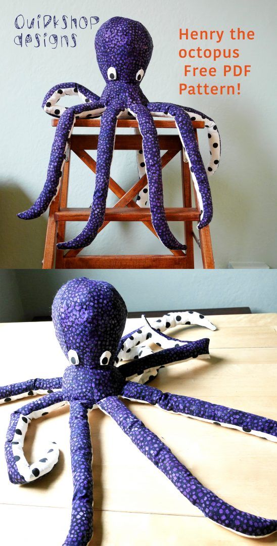 an octopus made out of purple yarn sitting on top of a wooden table next to a chair