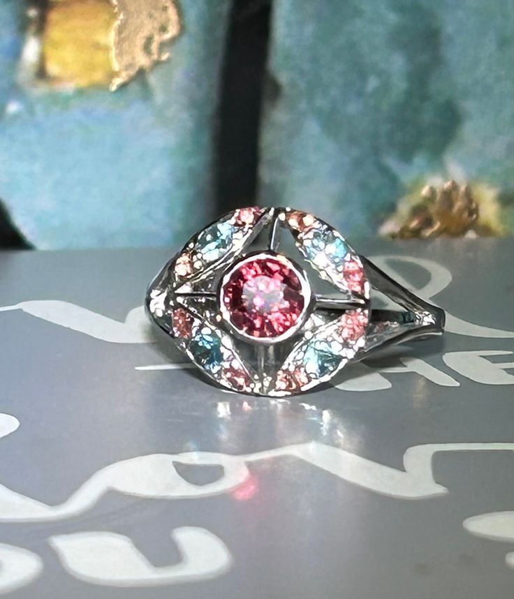 Genuine Multi Gemstones Mini Cocktail Ring Metal Type: Sterling Silver 925 White Gold Plated Size : 5.25 Main Stone: Pink Garnet  Color: Pink Cut: Facet Round Cut Blue Zircon Dimension Approximate: 3 mm Round Cut Pink Sapphire Dimension Approximate: 2 mm Ready to ship in 1-3 business days. ---- For more questions, please don't hesitate to contact me ---- You can also send me a message straight from Etsy  Thank you for taking the time to browse our galleries and we hope you will be able to visit Garnet Color, Pink Garnet, Garnet Gem, Pink Sapphire Ring, Halo Earrings, Domed Ring, Ring Metal, Blue Zircon, Cocktail Ring