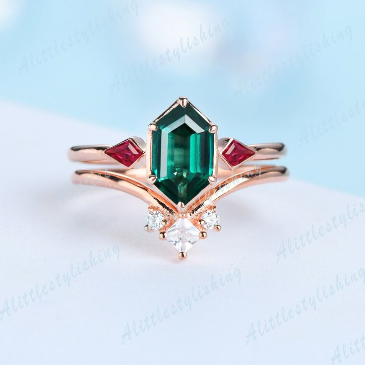 Emerald Ruby Wedding Ring Set, Art Deco Emerald Engagement Ring, Bridal Set, Unique Curve Wedding Band ❈Item detail❈ ✼Engagement ring: -Main stone: 5x9mm Long Hexagon cut Lab created Emerald -Side stones: Kite Cut 0.22ct Lab created Ruby -Material:925 sterling silver/ white gold plated/ rose gold plated / yellow gold plated / 10K/14K/18K solid gold available ✼Wedding band: -Stones: Princess & Round cut 0.15ctw Moissanite stones -Material:925 sterling silver/ white gold plated/ rose gold plated / Emerald-cut Diamond Ring For Wedding, Emerald-cut Diamond Wedding Ring, Art Deco Green Diamond Ring For Wedding, Emerald Cut Emerald Wedding Ring, Art Deco Emerald Wedding Ring For May Birthstone, Art Deco Emerald Wedding Ring May Birthstone, Art Deco Green Diamond Wedding Ring, Green Diamond Crystal Ring For Wedding, Emerald Marquise Cut Diamond Wedding Ring