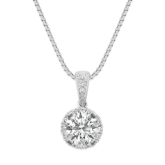 Nineteen sparkling round diamonds  at approximately .11 carat total weight  serve as the perfect backdrop to the center stone of your choice at approximately .50 carat in this dazzling 14 karat white gold pendant.  The design hangs from an 18-inch matching box chain. Please contact a customer service representative for additional information or questions regarding your center stone selection. 14k White Gold Diamond Necklace With Brilliant Cut, Platinum Necklace With Round Cut Diamond Accents, Platinum Necklace With Diamond Accents, Diamond White Platinum Necklace With Prong Setting, Classic Cubic Zirconia Necklace With Prong Setting, White Gold Diamond Cut Pendant Diamond Necklace, Dazzling Diamond White Necklace With Halo Setting, White Gold Diamond Cut Pendant Necklace, Dazzling Silver Diamond Necklace With Halo Setting