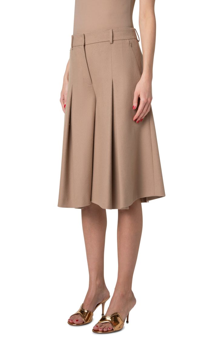 Front pleats release to flare the legs and bring swing to the silhouette of these knee-length culottes unexpectedly tailored from wool flannel. Zip fly with hook-and-bar closure Front zip-slant pockets; back welt pockets 100% virgin wool Dry clean Made in Romania Designer Clothing Elegant Short Culottes For Spring, Elegant Short Length Culottes For Spring, Elegant Short-length Spring Culottes, Pleated Knee-length Bottoms For Work, Knee-length Pleated Bottoms For Work, Elegant Short Bottoms With Box Pleat, Formal A-line Bottoms With Box Pleat, Chic A-line Wool Bottoms, Chic Tailored Knee-length Bottoms