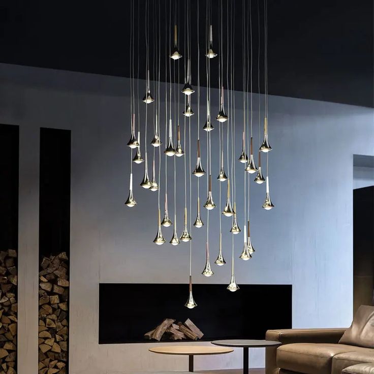 a chandelier hanging from the ceiling in a living room