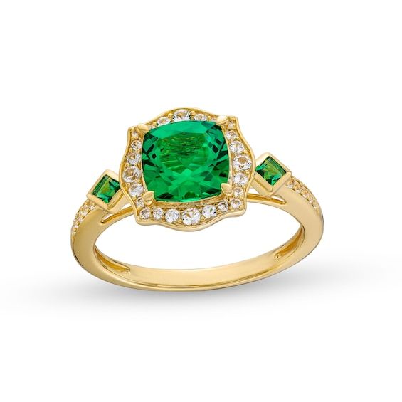 Achieve a most charming look with this lab-created emerald and diamond floral frame ring. Sterling silver with 14K gold plate. The 7.0mm cushion-cut lab-created emerald is surrounded by a floral frame of multi-sized diamonds. Tilted bezel-set Asscher-cut lab-created emeralds flank the centerpiece. Diamond-lined shank completes the design. 1/5 ct. t.w. of diamonds. Classic Green Halo Ring With Diamond Accents, Elegant Green Diamond Ring With Halo Design, Elegant Green Rings With Halo Design, May Birthstone Brilliant Cut Halo Ring, May Birthstone Halo Ring With Brilliant Cut, Elegant Green Halo Ring With Cubic Zirconia, Elegant Green Cubic Zirconia Halo Ring, Formal Green Cubic Zirconia Halo Ring, Formal Green Birthstone Ring With Halo Setting