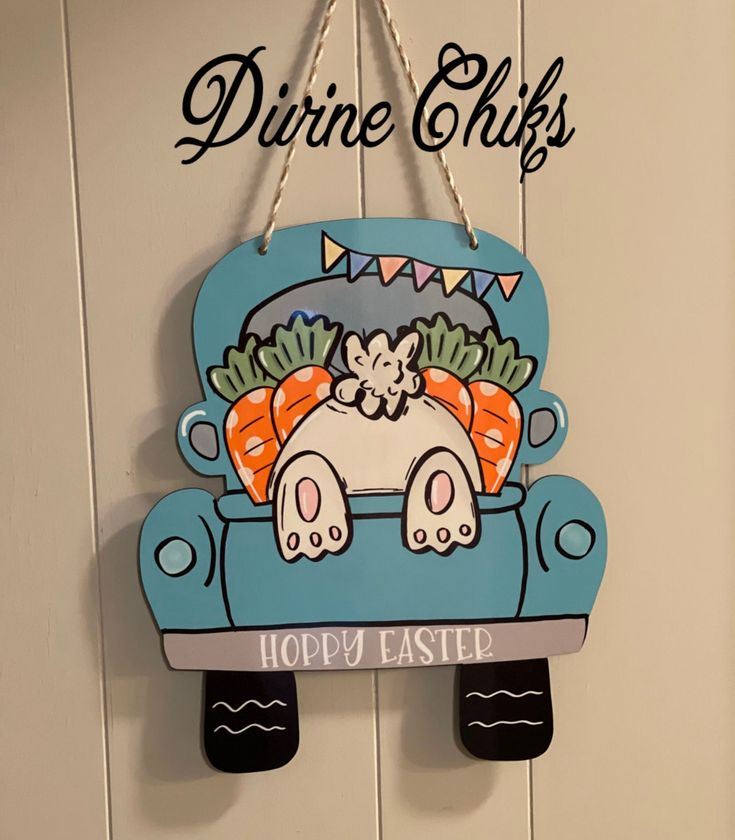 a sign hanging on the side of a wall that says drive chicks hoppy easter