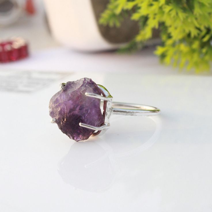 Raw light Amethyst silver ring / rough and natural stone/ Raw gemstone ring / unique piece / Handmade Jewelry wedding ring Product Description - Material :- 925 Sterling Silver Gemstone :- Amethyst  Style : Minimalist  Jewelry Care Instruction- Always: Apply lotion, cosmetics, hairspray and perfume before dressing in jewelry. When undressing, wipe each piece with a clean soft cloth to remove oils and perspiration. Store in a fabric-lined box, separately or individually-wrapped in tissue to preve Promise Ring With Raw Stone Crystal Open Ring, Elegant Silver Ring With Raw Stone, Raw Stone Crystal Promise Ring In Sterling Silver, Silver Amethyst Necklace With Raw Stone, Spiritual Amethyst Jewelry With Raw Stone, Gemstone Rings Unique, Amethyst Geode Raw Stone Gift, Raw Amethyst Ring, Raw Gemstone Ring