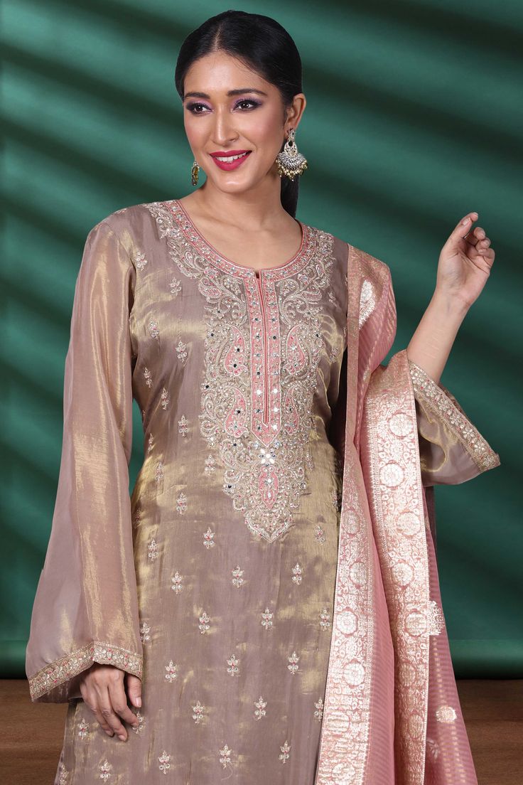 Indulge in luxury with our Partywear Suit D-163. Adorned with exquisite mirror and stone work, each piece is a work of art that will elevate your style. Make a statement and stand out from the crowd at any event with this stunning suit. Up your fashion game with this premium piece. Festive Semi-stitched Hand Embellished Kurta, Traditional Hand Embellished Chanderi Sharara, Hand Embellished Georgette Palazzo Set For Wedding, Hand Embellished Unstitched Palazzo Set For Wedding, Bollywood Style Hand Embellished Chanderi Kurta, Wedding Hand Embellished Georgette Palazzo Set, Unstitched Hand Embellished Sets For Diwali, Embellished Tissue Silk Saree Set, Hand Embellished Unstitched Sets For Diwali