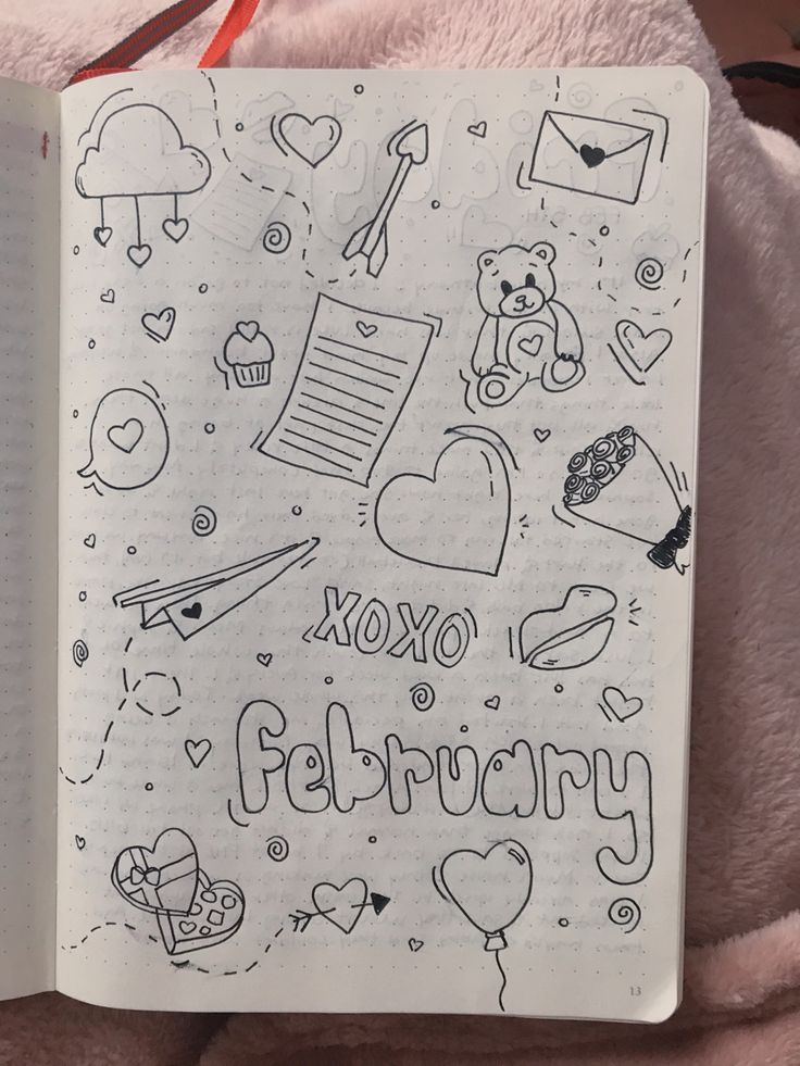 an open notebook with doodles on it and the words xoxo february written in cursive writing