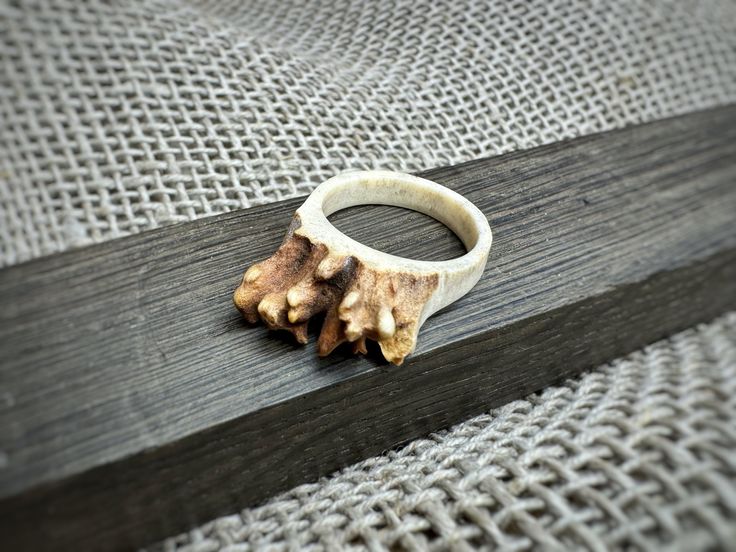 "Handcarved antler ring \"Nature Touch\". Unlock the essence of strength, courage and goodluck with our original handcarved antler unisex ring. Our antler rings are more than just accessories - they embody the powerful symbolism of antlers, representing strength, courage, and the cyclical nature of life. Adorn yourself or a loved one with a talisman that brings good luck and protective energies. - Unique Gift - Real Antler - Original Design - Sustainable and Ethical Sourcing - Handmade in Lithuania.  No animals were harmed, we use only naturally shed antlers. More of our antler jewelry you can find here: https://balticantler.etsy.com?section_id=43062805 Other items from antler please check out at our shop here: https://balticantler.etsy.com" Antler Rings, Deer Antler Jewelry, Antler Crafts, Antler Jewelry, Shed Antlers, Antler Ring, Her And Him, Stark Sein, Deer Antlers