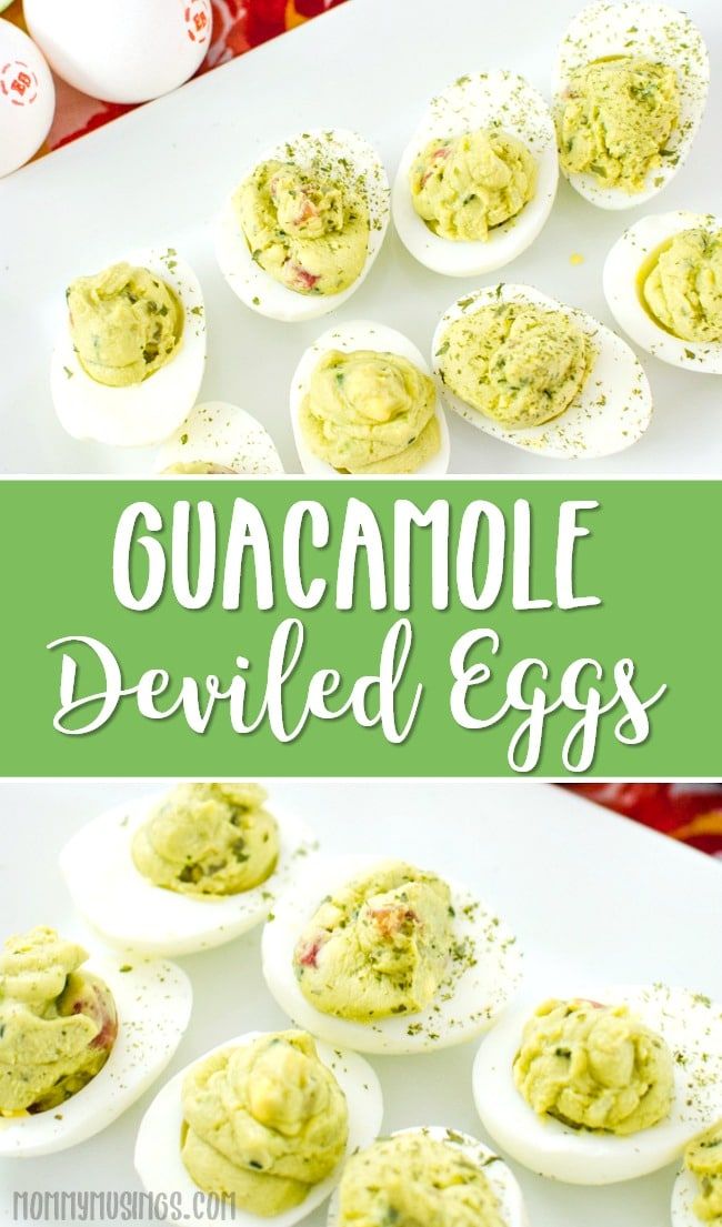 deviled eggs filled with guacamole and topped with mayonnaise