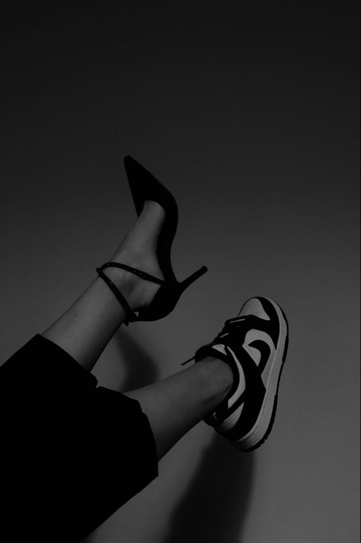 black and white photo of woman's legs wearing high heels