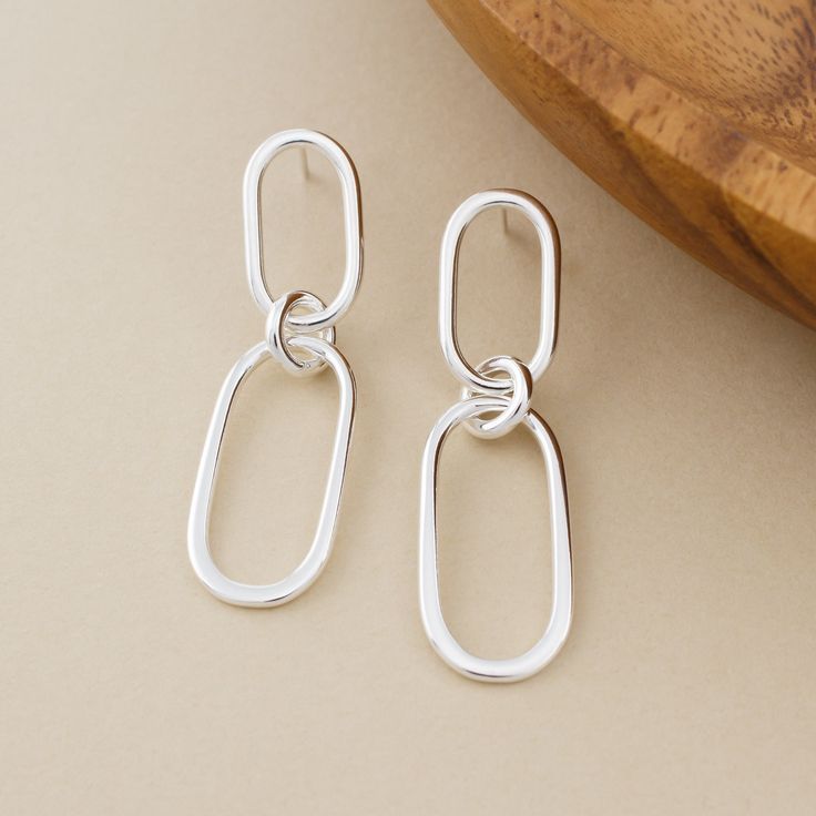 Forged by hand in solid sterling silver, the Paperclip Link Earrings feature elongated oval-shaped dangles that are artfully hammered to a tapered form. The top link features a stud post on the back for a sleek, modern look. These earrings are made-to-order by hand in our bespoke metalsmithing studio in Stockport, New York. Instead of casting multiples of our designs, we fabricate each element by hand the old-school way using torches, hammers, and files on raw silver. Therefore, each pair of ear Silver Earing Design, Modern Sterling Silver Oblong Earrings, Modern Oblong Sterling Silver Earrings, Silver Oblong Earrings, Handmade Sterling Silver Earrings, Simple Silver Earrings, Handmade Silver Earrings, Elongated Oval, Handmade Silver Jewellery