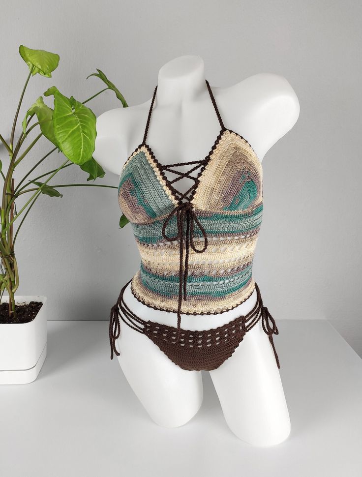 🏖️ Dive into summer with our exquisitely handcrafted crochet bikini set, made from high-quality acrylic yarn. This unique, bohemian-style swimwear offers the perfect blend of comfort and style, making it ideal for beach outings, pool parties, and tropical vacations. Each piece is carefully designed to provide a flattering fit, ensuring you feel confident and chic wherever you go. * Material: 100% soft acrylic yarn for durability and comfort. * Design: Elegant crochet pattern with adjustable str Bohemian Fitted Swimwear For Beach Cover-up, Beachwear Festival Halter Top With Crochet Trim, Handmade Crochet Beachwear Top For Beach Cover-up, Bohemian Crochet Lace Halter Top For Beach, Bohemian Crochet Lace Halter Top For Vacation, Fitted Crochet Beachwear Top For Beach Party, Handmade Crochet Beachwear Top, Handmade Crochet Beach Cover-up Top, Handmade Crochet Top For Beach Cover-up