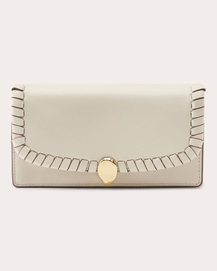 Crafted from LWG-certified Italian leather, the Helen Kaminski's Blisse wallet can be styled as a clutch or crossbody thanks to its detachable chain strap. Whipstitch trim, gold-tone hardware and interior compartments reflect elevated attention to detail.Detachable chain strapMagnetic flap closureInterior card slots and zip compartmentGold-tone hardwareWhipstitch trimOuter: 100% Italian cow leatherLining: 100% cottonSpot cleanMade in Sri Lanka Measurements Width: 11.5in Height: 10in Depth: 4in S Timeless Rectangular Wallet On Chain For Everyday Use, Versatile Leather Evening Wallet, Chic Wallets With Magnetic Closure For Everyday Use, Chic Wallet On Chain With Card Slots, Chic Everyday Wallets With Magnetic Closure, Chic Everyday Wallet With Magnetic Closure, Beige Leather Evening Wallet On Chain, Crossbody Wallet On Chain With Magnetic Closure, Beige Leather Wallet On Chain For Evening