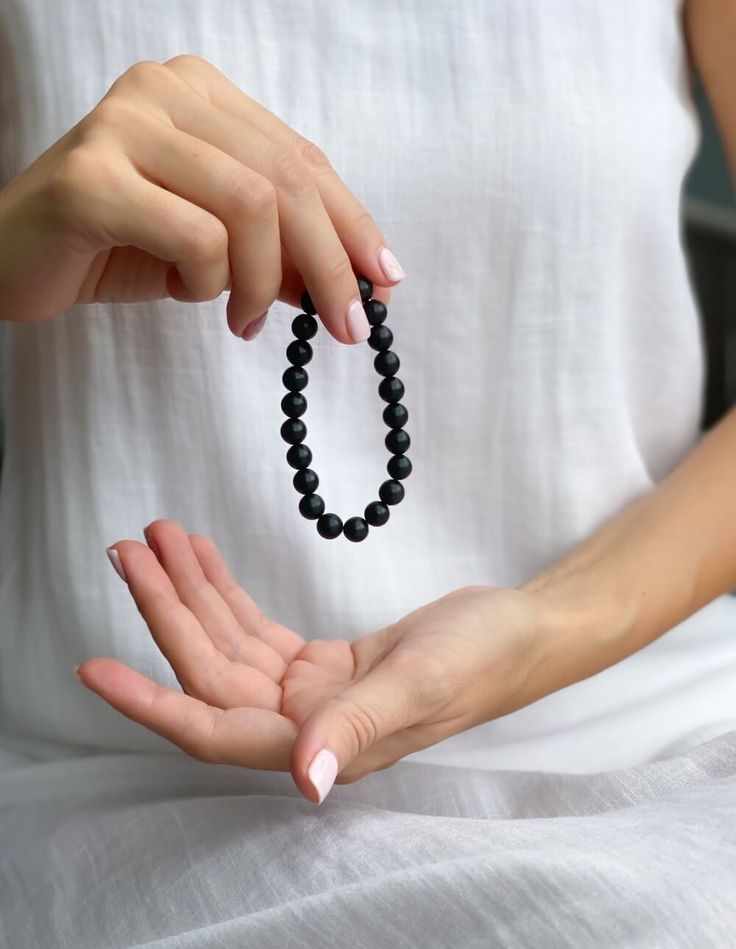 This obsidian beaded bracelet is the perfect way to add a touch of natural magic to your look. The black beads are said to contain powerful healing energy and are thought to bring good luck and protection against negative forces.

This Black obsidian bracelet is the perfect way to access the power of the universe. Made with natural obsidian stones, this bracelet is a powerful tool for better health, peace of mind, and spiritual growth.