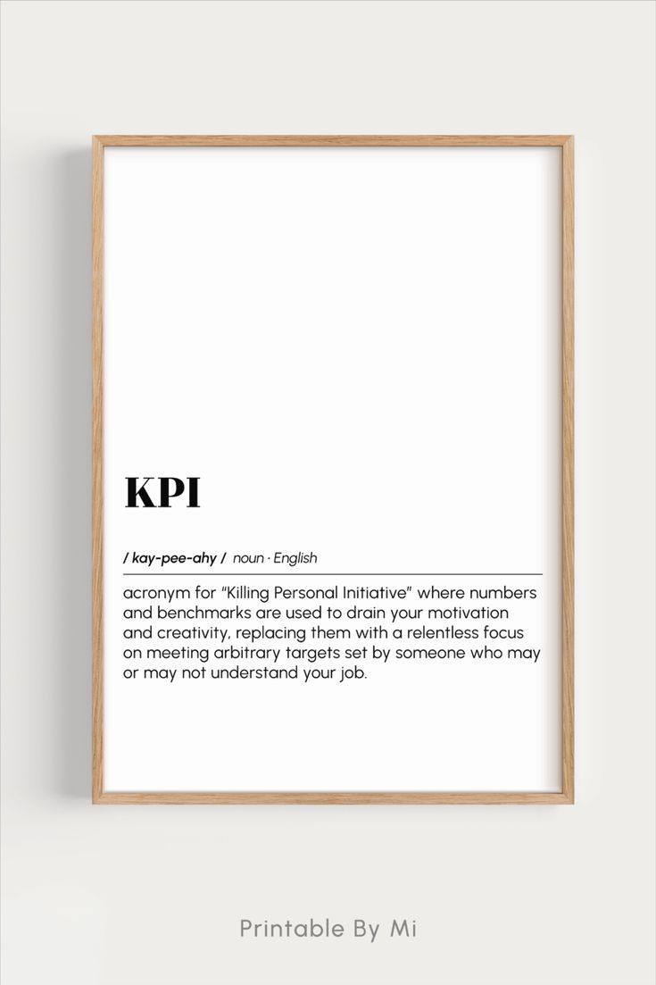 a framed poster with the words kpi on it in black and white, next to a