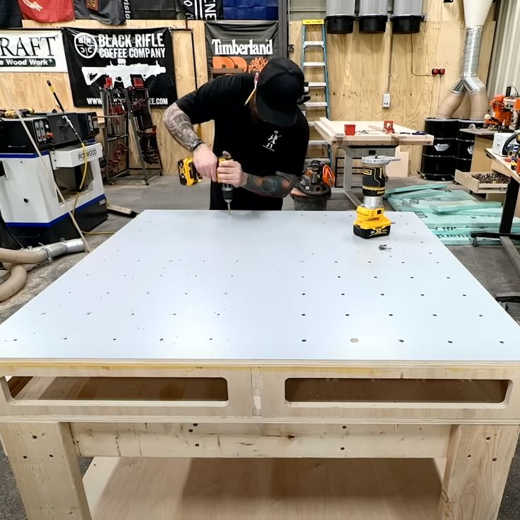 a man working on a workbench in a shop