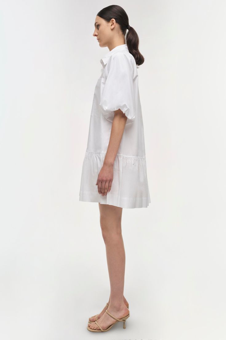 SIGNATURE COLLECTION The Crissy Dress in White. Casual, wear-everywhere shirting inspired mini dress with a relaxed, puffed fit and ballooned short sleeves. Casual Mini Dress, One Piece Clothing, Mini Dress Casual, White Shirt Dress, Mini Shirt Dress, Knitwear Tops, Romper With Skirt, Signature Collection, Shop Swimwear