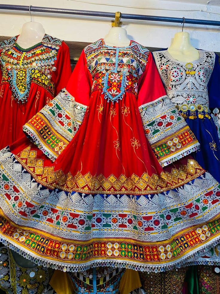 Crafted in a rich colorful fabric, this dress features intricate embroidery, vibrant colors, and decorative patterns that celebrate the beauty of folk craftsmanship. Perfect for festive occasions and cultural events, this handcrafted attire exudes elegance and tradition, making it a standout piece in any wardrobe. Embrace the charm of ethnic wear with this exquisite, one-of-a-kind outfit Traditional Red Dresses For Eid, Traditional Multicolor Dresses For Eid, Multicolor Embroidered Dress For Eid Ceremonies, Multicolor Festive Dress For Navratri, Red Traditional Dress For Eid, Folk Style Dresses With Traditional Patterns For Eid, Festive Dresses With Traditional Patterns, Navratri Dress With Embroidered Border, Red Dress For Navratri Traditional Ceremonies