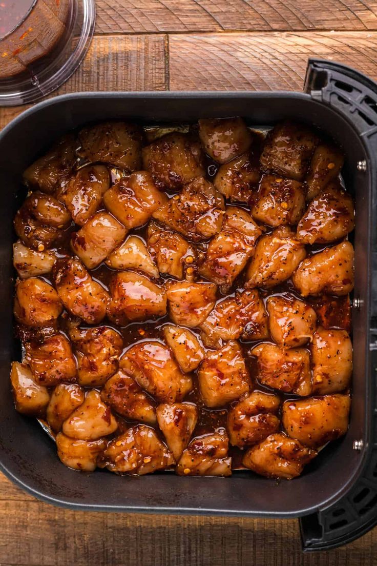 the food in the pan is ready to be cooked and put on the table for consumption