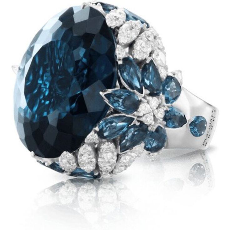 Indulge in pure luxury with the 18k White Gold Ghirlanda Couture Ring from Pasquale Bruni. This exquisite piece features a breathtaking London Blue Topaz gemstone that sparkles in the light, surrounded by a halo of diamonds that perfectly complement its blue hues. The ring's intricate design is reminiscent of delicate garlands, creating a truly unique and timeless piece that exudes elegance and sophistication.Crafted from the finest 18k white gold, this ring is a true masterpiece of Italian craf Pasquale Bruni, Diamond Birthstone, Jewelry Appraisal, London Blue Topaz, London Blue, Diamond Wedding Rings, Cocktail Rings, Jewelry Branding, Luxury Jewelry