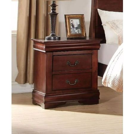 a night stand with two drawers and a lamp