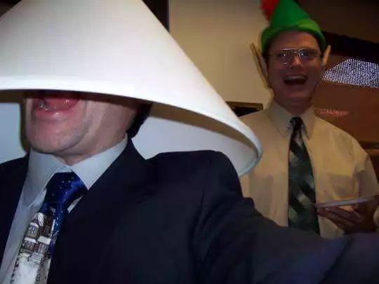 two men dressed up in funny hats and ties