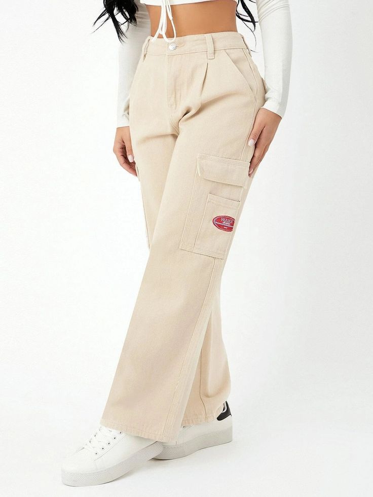 Unveil your fashion flair with our High Waist Pocket Side Wide Jeans. These cargo pants showcase a high waistline and a loose fit, creating a trendy and comfortable ensemble. The non-stretch denim fabric offers durability, while the zipper fly closure ensures easy wear. With a distinctive letter pattern and practical pockets, these tapered jeans are a versatile addition to your wardrobe. Details: Pattern Type: Letter Type: Tapered/Carrot Jeans Style: Cargo Pants Closure Type: Zipper Fly Waist Li Casual Wide-leg Cotton Cargo Jeans, High Waist Wide Leg Cotton Pants With Multiple Pockets, High Waist Cotton Wide Leg Pants With Multiple Pockets, Trendy Cotton Cargo Pants With Patch Pockets, High-rise Cotton Cargo Pants For Streetwear, Baggy Mid-rise Cotton Parachute Pants, Beige Cargo Jeans With Patch Pockets For Streetwear, High Rise Cotton Cargo Pants For Streetwear, Mid-rise Beige Cotton Cargo Jeans