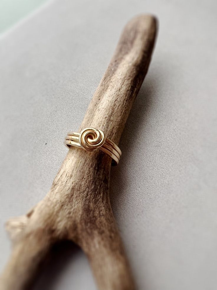 Meet the Parker Ring, a triple stack ring with a super chic top knot. Hypoallergenic All materials are 14k goldfill and with care will last a lifetime. Gold fill is 100x more bonded with gold, unlike plated gold which has a very fine dusting layer. It does not rub off or lose it’s shine and is hypoallergenic. Adjustable 14k Gold Jewelry With A Modern Twist, Twisted Gold Ring For Gift, 14k Gold Stackable Rings With Modern Twist As Gift, Gold Spiral Minimalist Stackable Rings, Adjustable Yellow Gold Stackable Rings With A Modern Twist, 14k Gold Twisted Rings For Gift, Modern Twist Recycled Gold Jewelry For Gift, Modern Twist Recycled Gold Jewelry Gift, Adjustable Midi Rings With A Modern Twist For Gifts