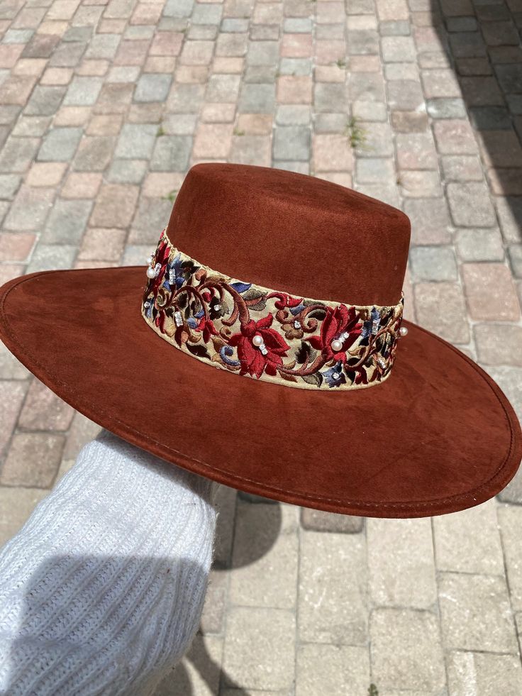 -Made in Guanajuato, Mexico -One size fits most -Stretch band to fit sizes S-L -Manmade -Shipped from Florida -15 in. L -14 in. W -6 in. H -Material felt -4 in. H Crown -Every hat is handmade and decorated to perfection, this hat has a bright beautiful bright rust color to add that wow to any outfit! -Not only will it help keep the cool with the sun, but it will bring all the attention with its bright color and small gems and pearls that will shine in the sunlight ! Vintage Hat Outfit, Embellished Cowboy Hat, Bohemian Hat, Burned Hats, Boho Hats, Bohemian Hats, Boho Hat, Large Hats, Boater Hat