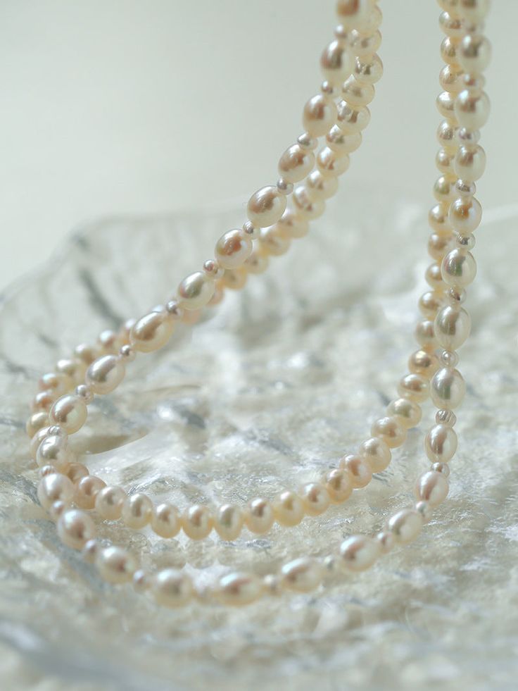 Product Information: Plating: White Gold Material: Freshwater Pearls (5-5.5mm) Size: Necklace Length 37-44 cm Weight: 28.5g Description: Elevate your style with our "Pulldown Double-Layer Beaded Pearl Necklace." This exquisite necklace features high-quality freshwater pearls, each measuring 5-5.5mm, and is elegantly plated with white gold. With an adjustable necklace length of 37-44 cm, it provides versatility in styling and ensures a perfect fit for any occasion. The double-layer design with de Double Strand Pearl Drop Necklace, Double Strand Pearl Beaded Necklace With Pendant, Classic Multi-strand Pearl Necklace, Double Strand Pearl Chain Beaded Necklaces For Layering, Double Strand Pearl White Necklace With Pearl Drop, Classic Multi-strand Pearl Necklace With Charm, Elegant Double Strand Beaded Necklaces With Pearl Drop, Pearl White Double Strand Necklace With Pearl Drop, Elegant Double Strand Beaded Necklace With Pearl Charm