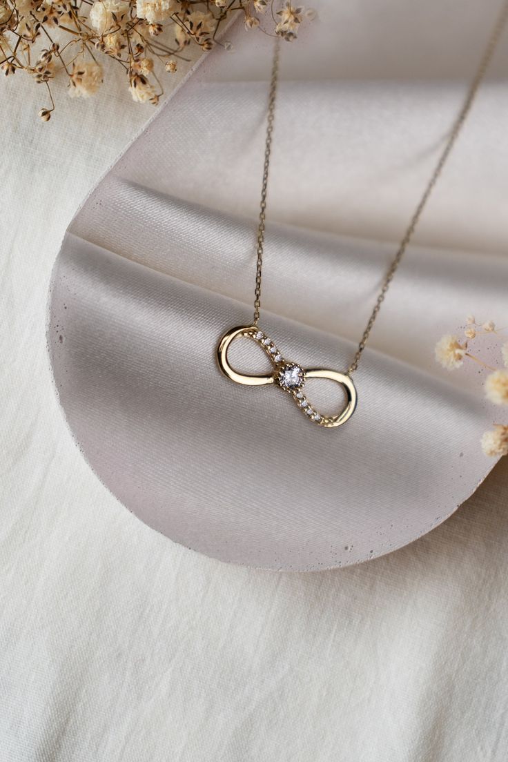 ABOUT PRODUCT 14K Gold Infinity Necklace, Gift for Her, Dainty Pendants, Minimalist jewelery,Women Necklace This 14K gold infinity  necklace is beautifully designed and hand crafted with our associates to make this a special gift for your loved ones. Knowing the value of our customers. We prepare each piece with extra care and attention. ITEM DETAILS Material: 14K Gold Approx: 1,90 gr Available colors: Gold, Rose Gold, White Gold Available Sizes: 14" to 20" ★ 14k Solid Gold (Certification will b Infinity Pendent Designs, Minimalist Infinity Necklace For Anniversary Gift, Dainty Infinity Necklace As Gift For Her, Minimalist Infinity Necklace For Anniversary, Minimalist Infinity Necklace In White Gold, Infinity Jewelry For Mother's Day, Minimalist White Gold Infinity Necklace, Infinity Yellow Gold Jewelry Gift For Her, Infinity-shaped Yellow Gold Jewelry Gift For Her