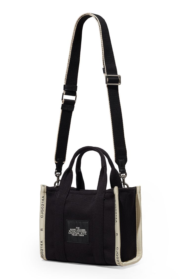 Easy top handles and an optional crossbody strap provide convenient carrying options for this lightly structured canvas tote stamped with bold branding. Top zip closure Top carry handle; removable, adjustable crossbody strap Textile Imported Chic Black Canvas Bag With Adjustable Strap, Chic Black Canvas Bag With Handles, Black Canvas Bag With Detachable Strap For Everyday, Black Canvas Top Handle Shoulder Bag, Chic Black Canvas Satchel, Black Canvas Shoulder Bag With Top Handle, Chic Canvas Shoulder Bag With Adjustable Handle, Black Canvas Satchel With Handles, Black Crossbody Canvas Bag