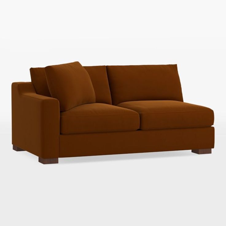 a brown couch sitting on top of a white floor