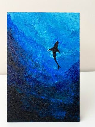 an acrylic painting of a shark swimming in the blue ocean with black background