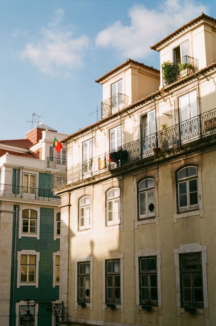 an apartment building with balconies and windows