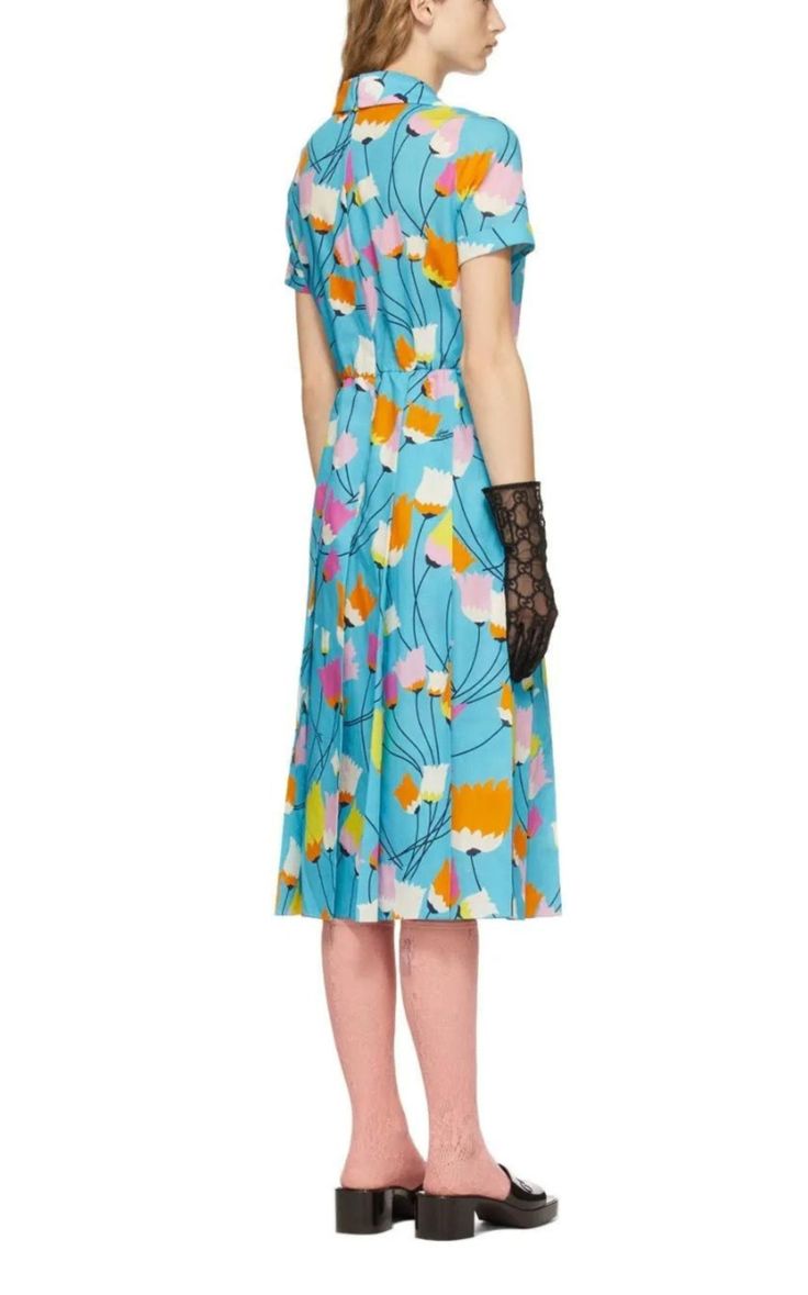 Short sleeve cotton and linen-blend poplin mid-length dress in blue. Multicolor floral pattern printed throughout. Open spread collar. Button closure at front. Belt loops, detachable belt with pin-buckle fastening, and pleats at elasticized waist. Zip closure at back. Tonal hardware. Supplier color: AzureMidi lengthComposition: 70% cotton, 30% linen.Dry CleanMade in Italy. Chic Gucci Midi Dress For Workwear, Elegant Gucci Midi Dress For Work, Chic Fitted Gucci Midi Dress, Gucci Fitted Midi Dress, Gucci Floral Print Dress For Spring, Gucci Short Sleeve Spring Dresses, Blue Retro Midi Dress For Spring, Retro Blue Midi Dress For Spring, Chic Gucci Midi Dress