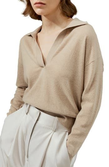 With dropped shoulder seams, the relaxed yet feminine silhouette of this open-neck polo highlights the plush texture of featherweight cashmere. The ribbed trim accents the neckline, ribbed cuffs, and hem, making it a versatile piece for all seasons. 100% cashmere Warm, soft and skin-friendly V-neck polo Refined universal basic Easy to style for any occasion Relaxed Fit Collared Sweater For Fall, Collared Sweater With Relaxed Fit For Fall, Chic Knit Polo Sweater With Ribbed Cuffs, Collared Polo Sweater With Relaxed Fit For Fall, Relaxed Fit Collared Polo Sweater For Fall, Classic Fall V-neck Sweater For Loungewear, Chic Cashmere Top With Ribbed Neckline, Collared Fall Loungewear Tops, Collared Loungewear Tops For Fall