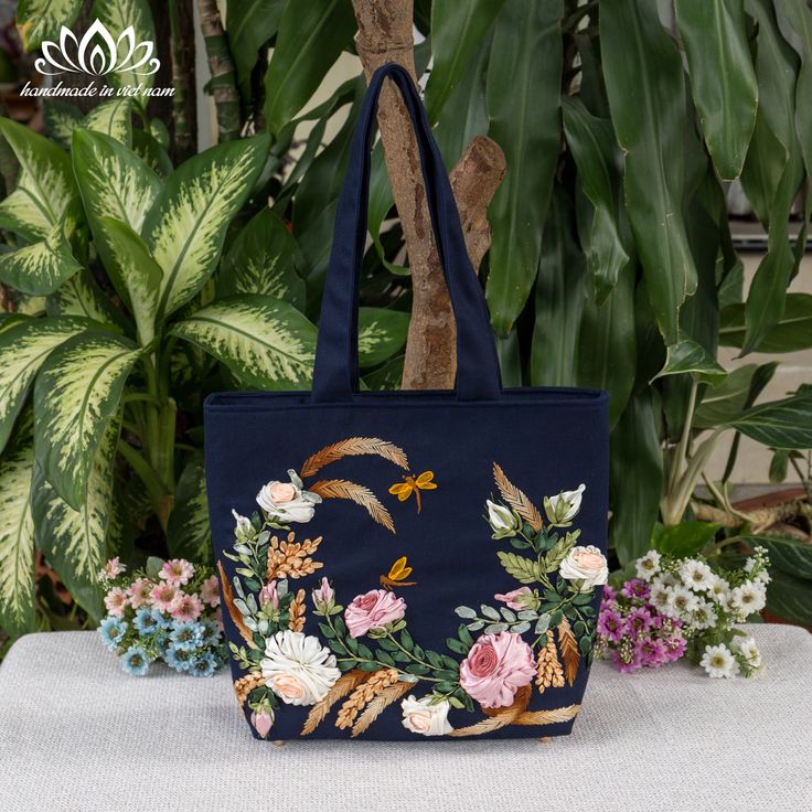 Hello! Welcome to my store! Wish you have a satisfying purchase！ When you have to think of a beautiful, meaningful, impressive gift for your lover, mother or friends then this will be the perfect choice for you! ⭐Don't hesitate to contact us if you have any questions! Thank you Embroidered shoulder bag ⭐The bag is handmade, each stage is meticulously cared for by skilled craftsmen. ⭐The bag is embroidered with very prominent, strange and beautiful ribbons. ⭐Full zippered entry ensures your essentials are kept safe and secure. +Fully lined +External zipper pockets +Internal zipper pockets +Internal pocket ⭐Size:  +Width : 14.96in / 38cm  +Height: 12.20in / 31cm +bottom: 3.93in/ 10cm Important: ⭐The product is handmade, so the size is approximated ⭐The actual product color may differ from th Rectangular Canvas Bag With Floral Embroidery For Gifts, Rectangular Floral Embroidery Canvas Bag Gift, Floral Embroidery Canvas Tote Bag Gift, Floral Embroidered Canvas Tote Bag Gift, Gift Floral Embroidered Canvas Tote Bag, Gift Floral Embroidery Canvas Tote Bag, Embroidered Tote Shoulder Bag Gift, Tote Bag With Zipper, Embroidered Shoulder Bag