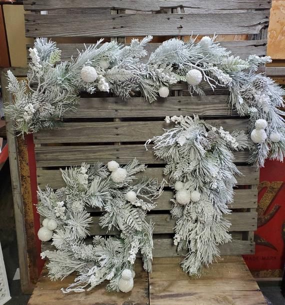 a wooden pallet with christmas decorations on it