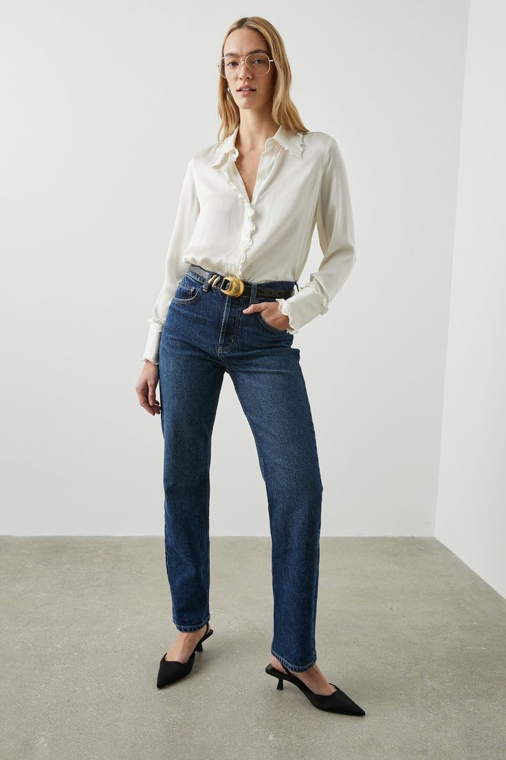 Made 100% from silk charmeuse, the Fia top is a luxurious button-up with dainty ruffle detailing on the cuffs, button placket, and collar. Style with the Rails Topanga jeans and a pair of loafers. Elegant Denim Jeans For Fall, Elegant Jeans For Fall, Chic Button Closure Jeans For Work, Chic Workwear Jeans With Button Closure, Chic Jeans With Button Closure For Work, Elegant Straight Leg Jeans With Button Closure, Chic Workwear Jeans With Buttons, Chic Jeans With Buttons For Workwear, Elegant Business Casual Jeans For Fall