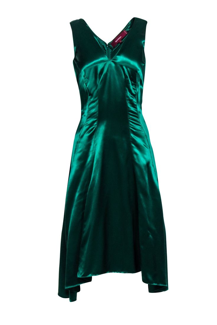 Look sleek and sexy this holiday season in a stunning Sies Marjan dress! An elegant option for a formal event or holiday cocktail party, this shimmering satin beauty will turn-heads with its gorgeous emerald green hue and elongated darts. Show off this midi's flattering high-low design with a pair of strappy metallic heels and plenty of gold jewelry. Size 4 100% Viscose Concealed back zipper V-neckline High-low hem Small snag on back near bottom Blemish at v-neckline Bust 32" Waist 30" Shoulder Sies Marjan, Holiday Cocktail Party, Holiday Cocktail, Metallic Heels, Sleeveless Midi Dress, Buy Shoes Online, Holiday Cocktails, Green Satin, Midi Dress Sleeveless