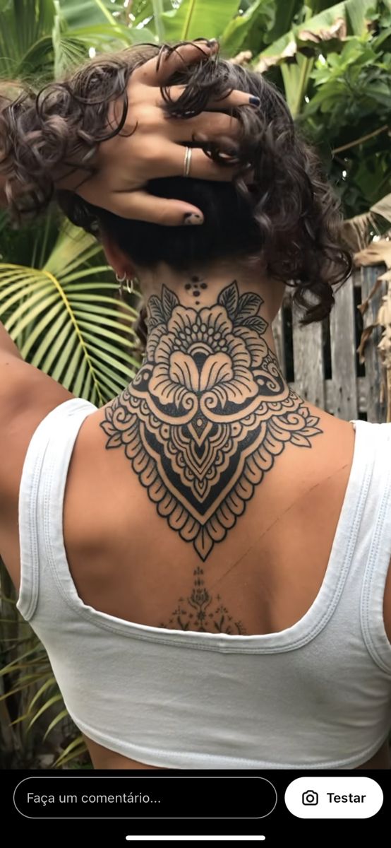 a woman with a tattoo on her back