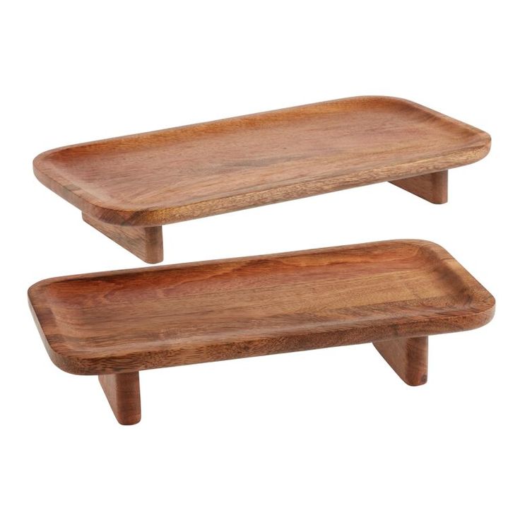 two wooden trays sitting on top of each other