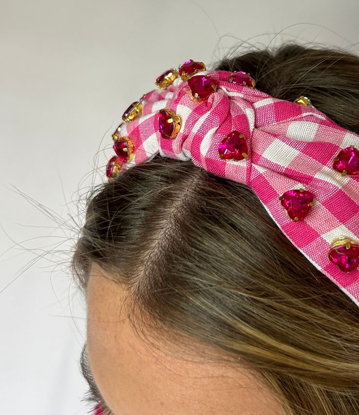 Step out in style with our Hearted Jeweled Headband in Pink & White! This charming Gingham headband features a stylish knot and heart gems, making it the perfect accessory for any outfit. With its comfortable design, you'll love wearing this headband all day long. Summer Gift Headpiece With Matching Headband, Summer Adjustable Ribbon Headband, Adjustable Headband As Spring Gift, Trendy Adjustable Headband For Gift, Adjustable Spring Headband Gift, Trendy Adjustable Hair Accessories For Gifts, Trendy Hair Accessories With Matching Headband As Gift, Trendy Hair Accessories Set With Matching Headband, Adjustable Summer Headband For Gift