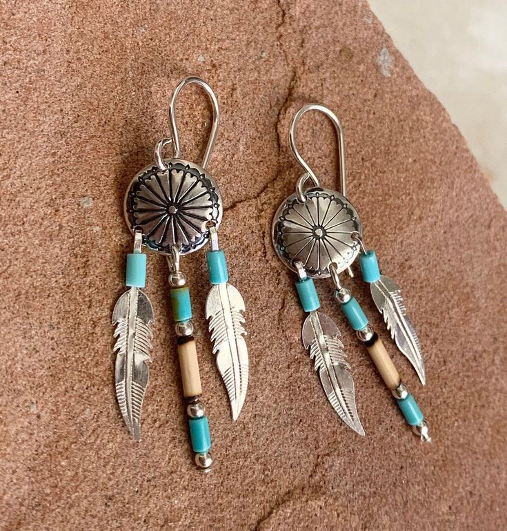 "Vibrant, Southwestern, and versatile dangle earrings that are handcrafted by me! These earrings are comfortable and lightweight, making it ideal for everyday wear. They add a pop of color and a Southwestern vibe. It would be a beautiful addition to your outfit! The stone is Kingman Turquoise. The turquoise is accompanied with bamboo. All findings are 925 sterling silver. Measurements: 1.75\" long with 10mm concho, 2x3mm Kingman Turquoise beads, and 2x6mm bamboo. The sterling silver feather is 1 Southwestern Turquoise Earrings For Festival, Southwestern Style Turquoise Earrings For Festival, Bohemian Turquoise Concho Earrings, Bohemian Concho Earrings For Festival, Bohemian Concho Dangle Jewelry, Southwestern Concho Earrings For Festivals, Turquoise Nickel-free Southwestern Earrings, Nickel-free Turquoise Southwestern Earrings, Nickel-free Southwestern Style Festival Earrings