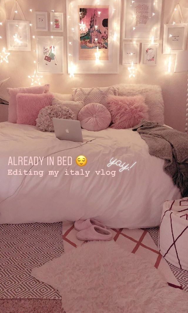 an instagram page with a bed and lights in the background