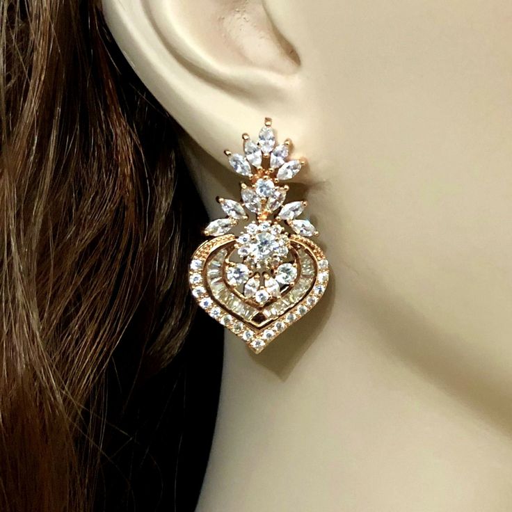 "A pair of glamour statement Art Deco Gatsby wedding style cz bridal earrings, made of high quality cubic zirconia in a choice of silver rhodium, yellow gold or rose gold plated base. Earrings are about 1 1/2\" (4 cm) including posts. View matching pieces or similar designs at https://etsy.me/2tIzwtX View designs with marquise shapes at https://etsy.me/2flzzGg View all earrings at https://etsy.me/1f8VFT4" Glamorous Diamond Wedding Earrings, Glamorous Diamond Earrings For Wedding, Glamorous Wedding Diamond Earrings With Diamond Accents, Glamorous Wedding Diamond Earrings With Accents, Glamorous Diamond Earrings With Sparkling Stones For Wedding, Glamorous Bridal Earrings With Diamond Accents For Anniversary, Glamorous Wedding Crystal Earrings With Diamond Accents, Dazzling Diamond Earrings For Wedding, Glamorous Diamond Earrings With Elegant Design For Wedding