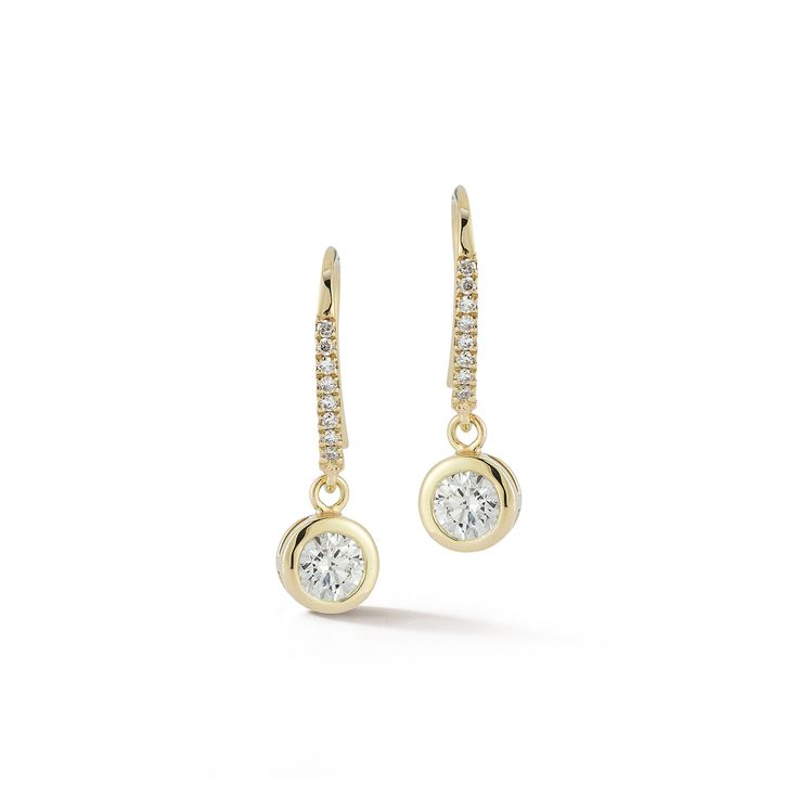 14kt Round Diamond Drop Earrings The Diamanté Collection takes its inspiration from Mateo's recent visit to the De Beers Orapa Diamond Mine in Botswana. Mother Nature has done a fantastic job creating these magnificent diamonds. Our only duty was to simply highlight each stone for daily wear. A brilliant round diamond is beautifully bezel set in solid gold and hangs from pave ear wire. 14kt Yellow Gold 1.37gm Gold 0.620ct Diamonds Ear Wire Made in New York City Dazzling Dangle Diamond Earrings With Pave Setting, Yellow Gold Dangle Earrings With Pave Setting, Dazzling Single Cut Diamond Drop Earrings, Yellow Gold Diamond Dangle Bridal Earrings, Luxury Diamond Halo Earrings For Everyday, Elegant 14k Gold Diamond Earrings With Accents, Yellow Gold Halo Design Dangle Diamond Earrings, Exquisite Drop Diamond Earrings With Single Cut Diamonds, Exquisite Single Cut Diamond Drop Earrings